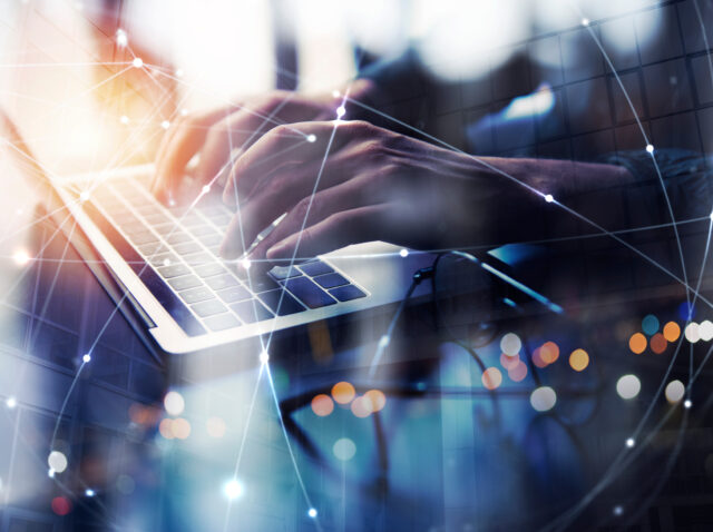 Business man works in office with laptop. Concept of internet network. double exposure